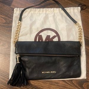 Pebble leather black Michael Kors handbag.